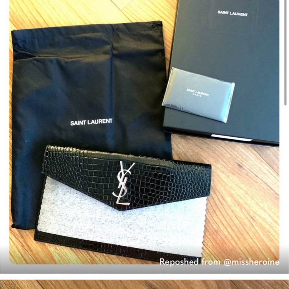 Pristine YSL glamorous aligator clutch.